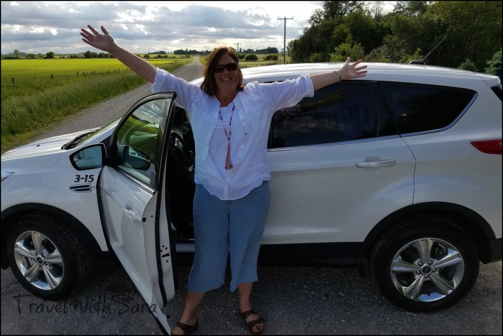 Sara with rental car