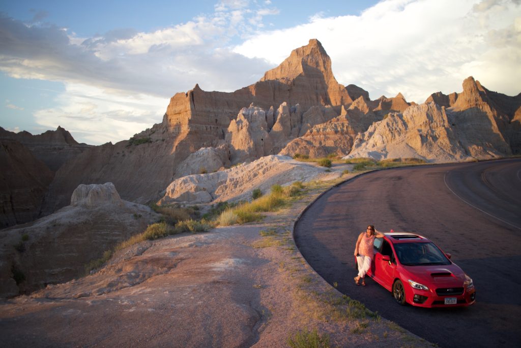 Sara and car in Badlands