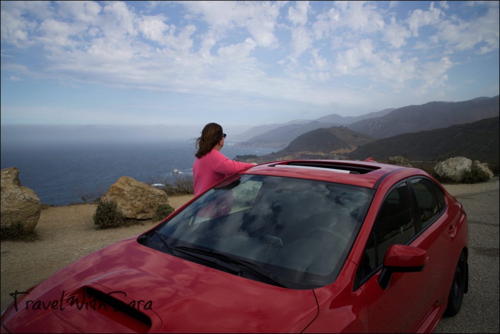 Sara with car along Pacific