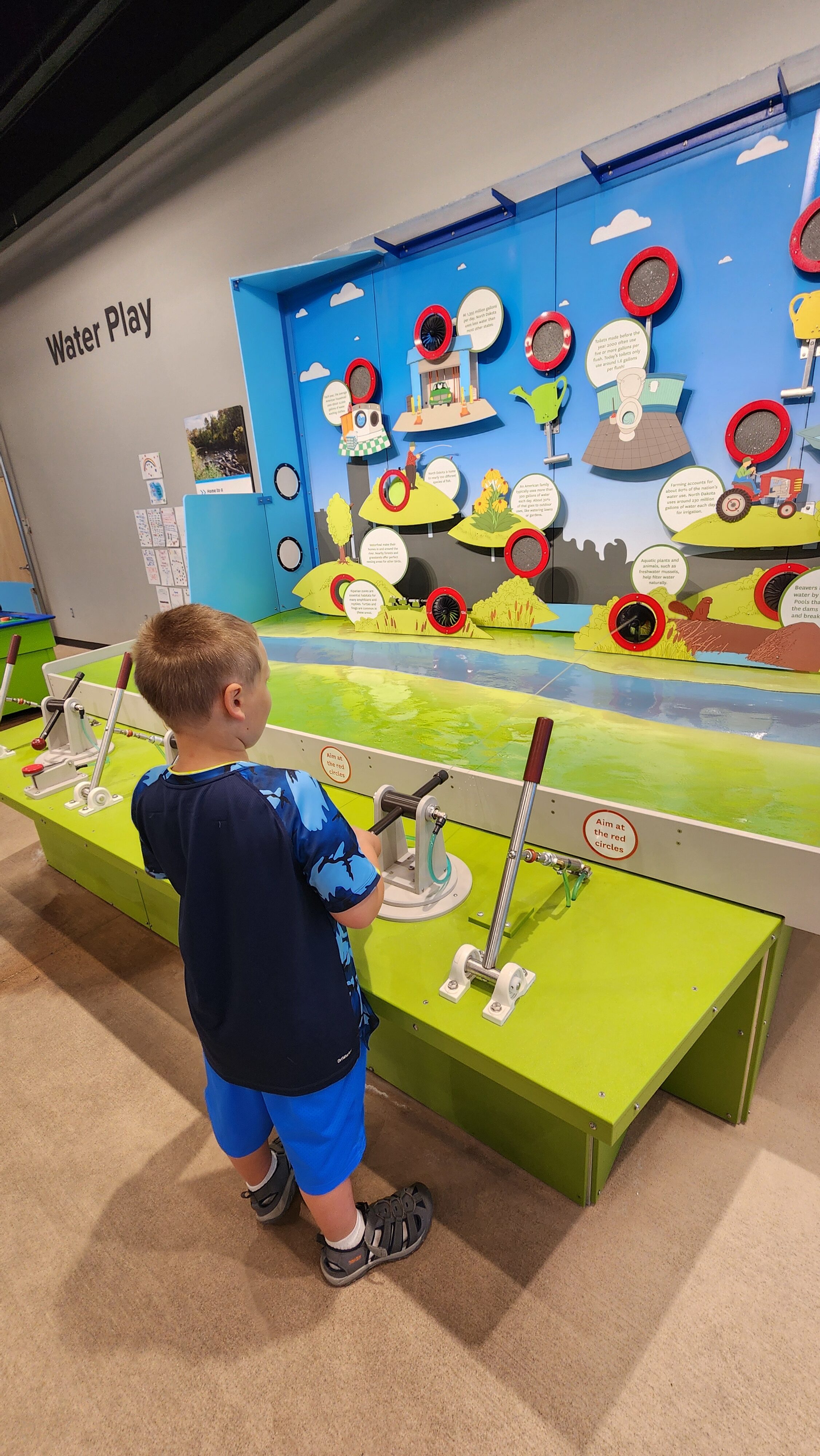 water at science museum with boy