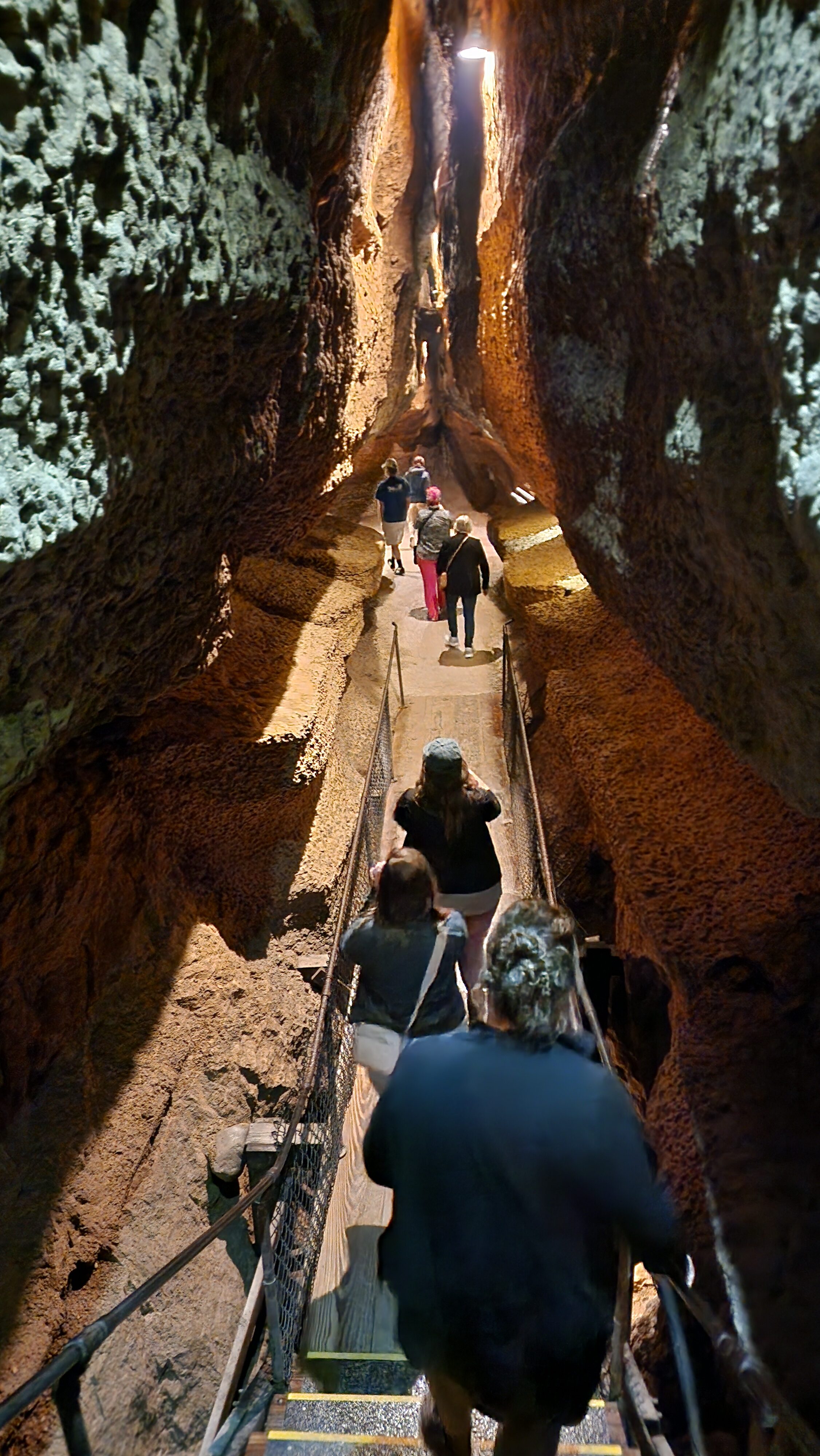 people walking in cave