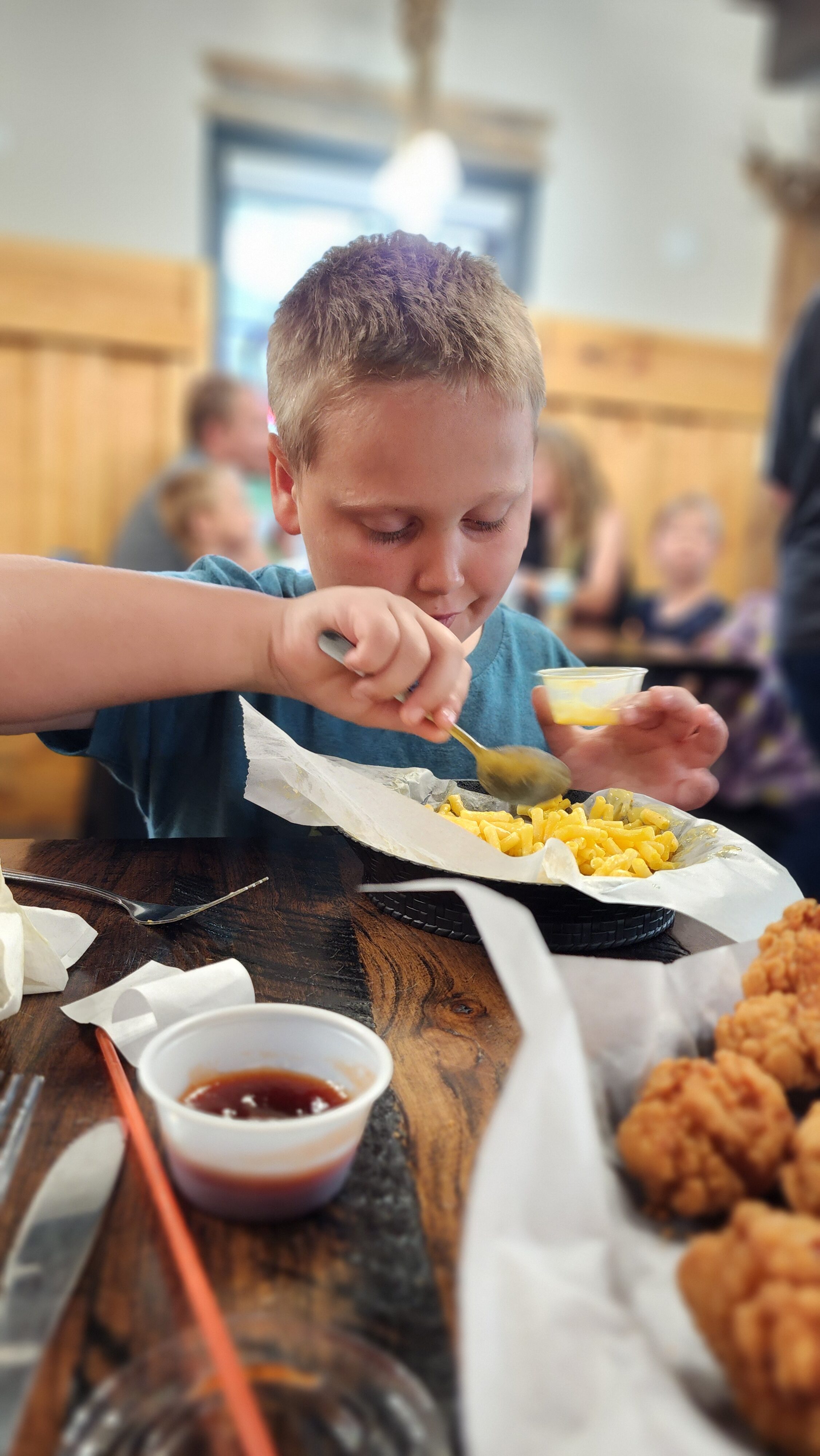 boy eating mac n cheese