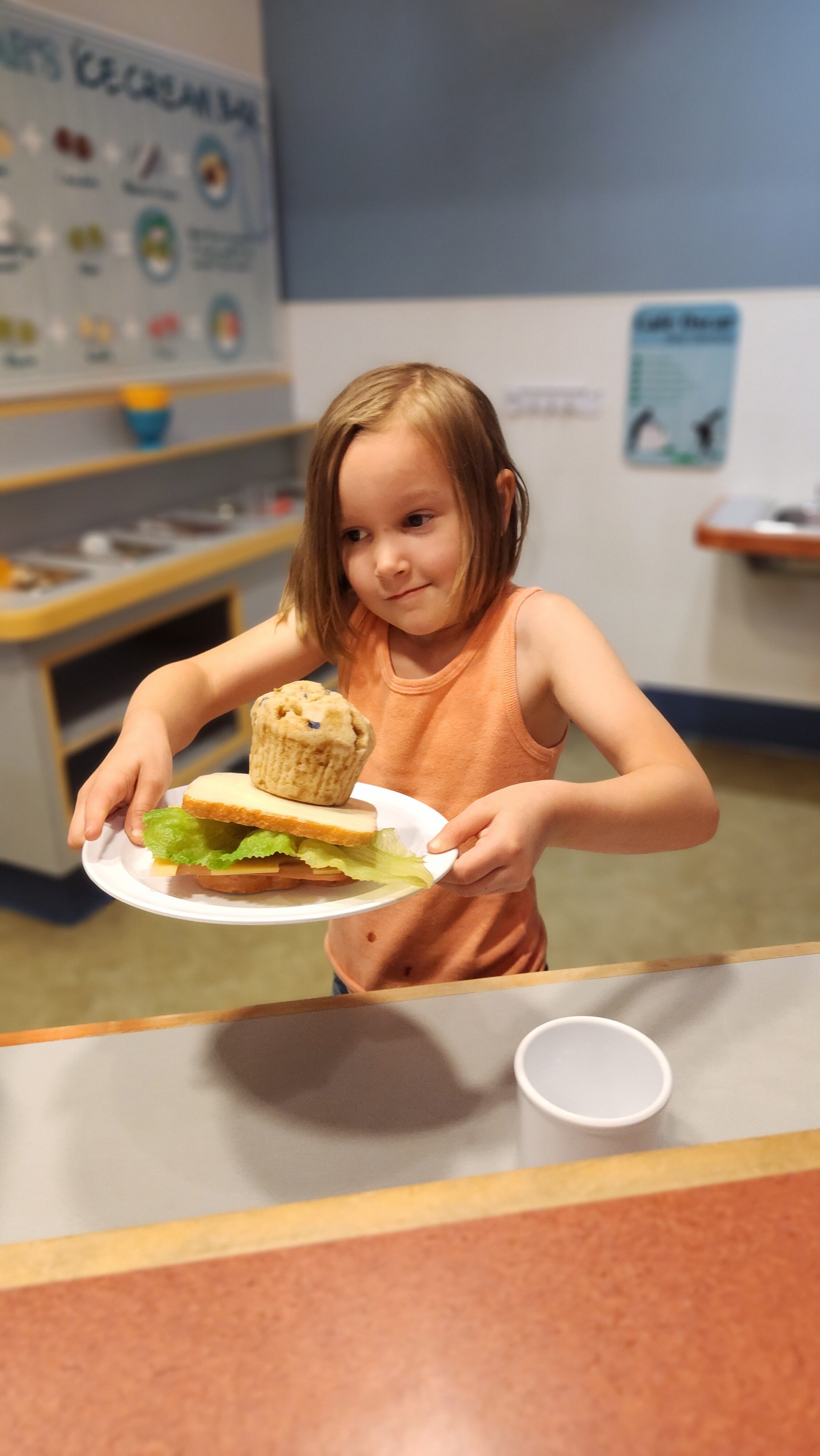 girl with food in museum