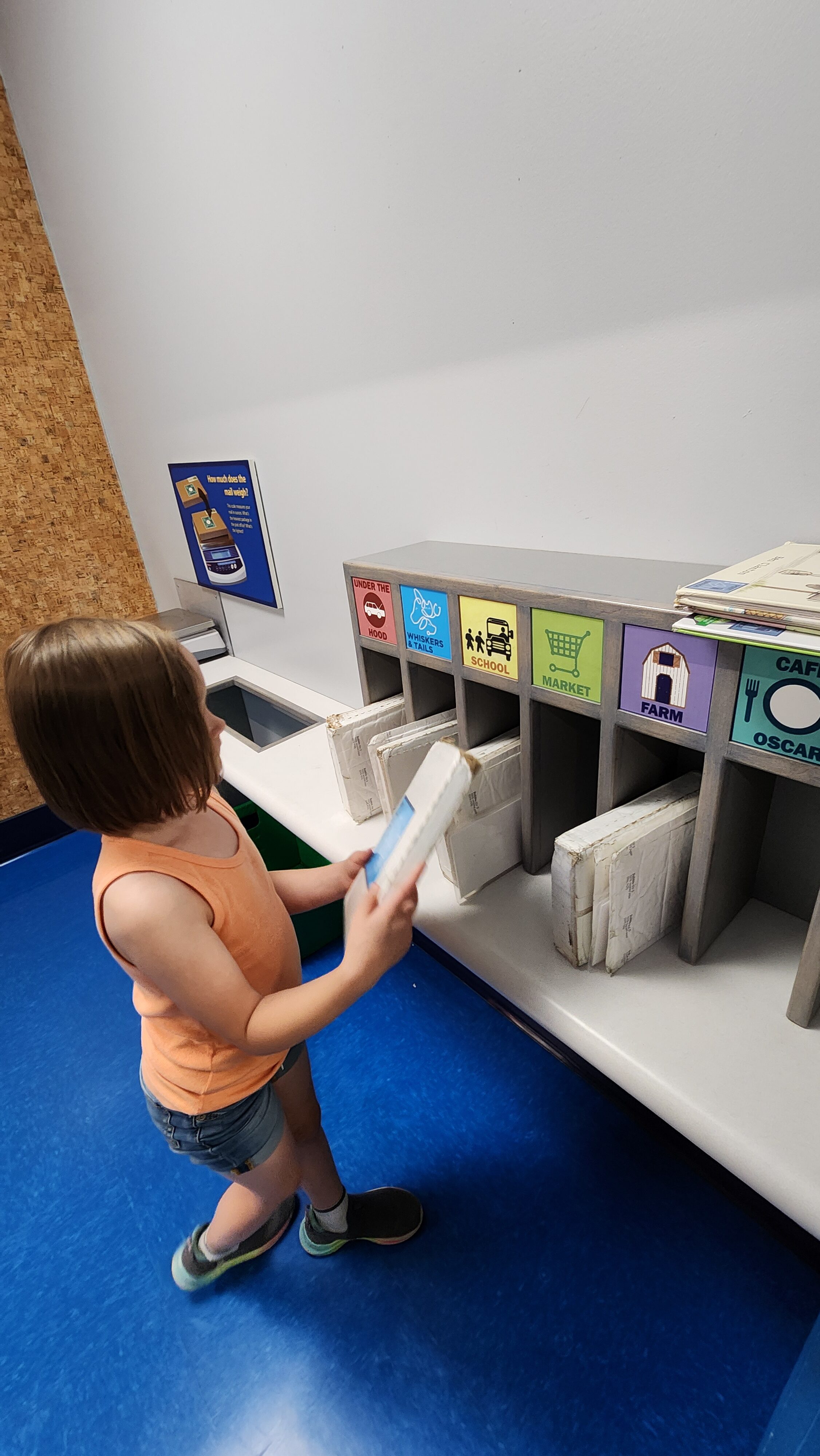 child in mailroom at museum