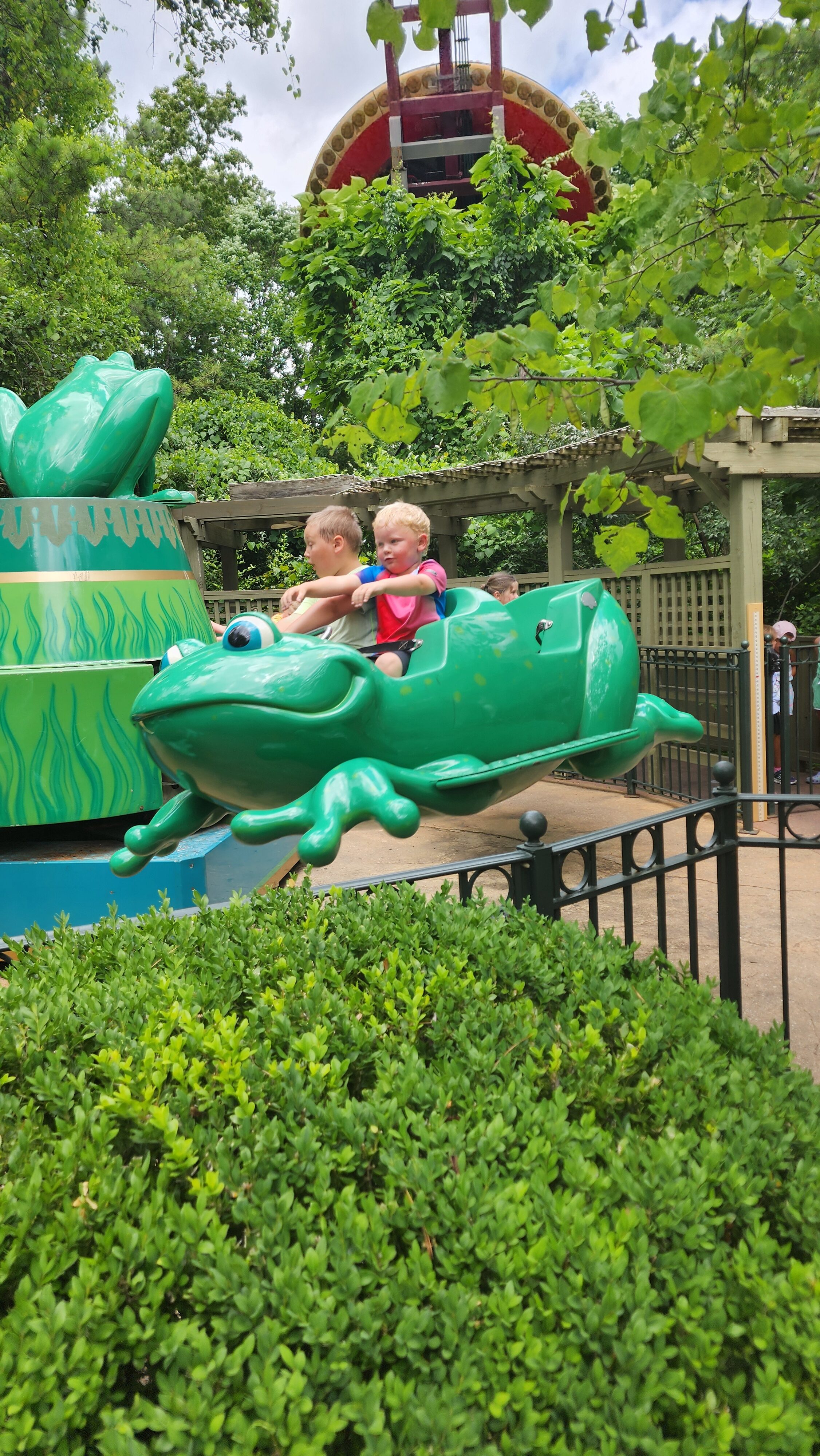 boys riding amusement park ride