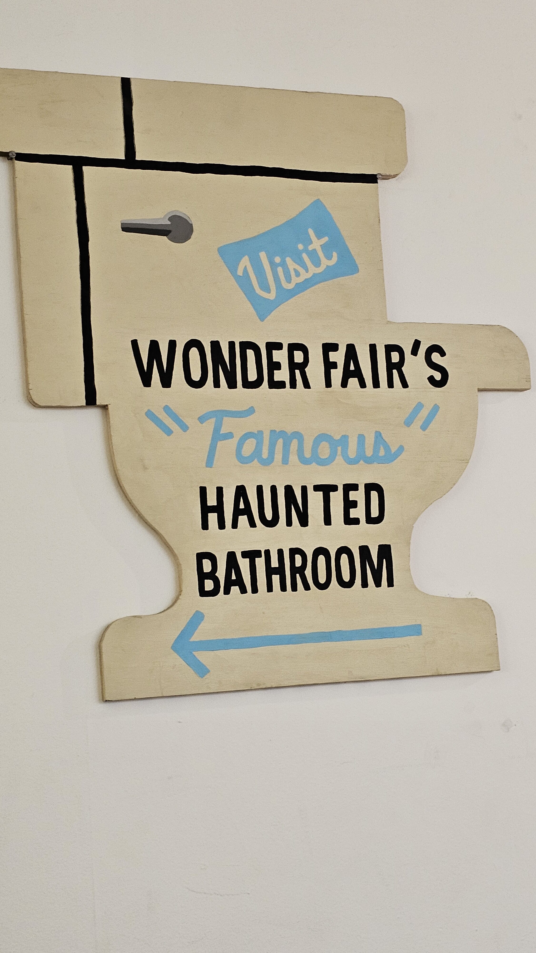 Sign to visit haunted bathroom