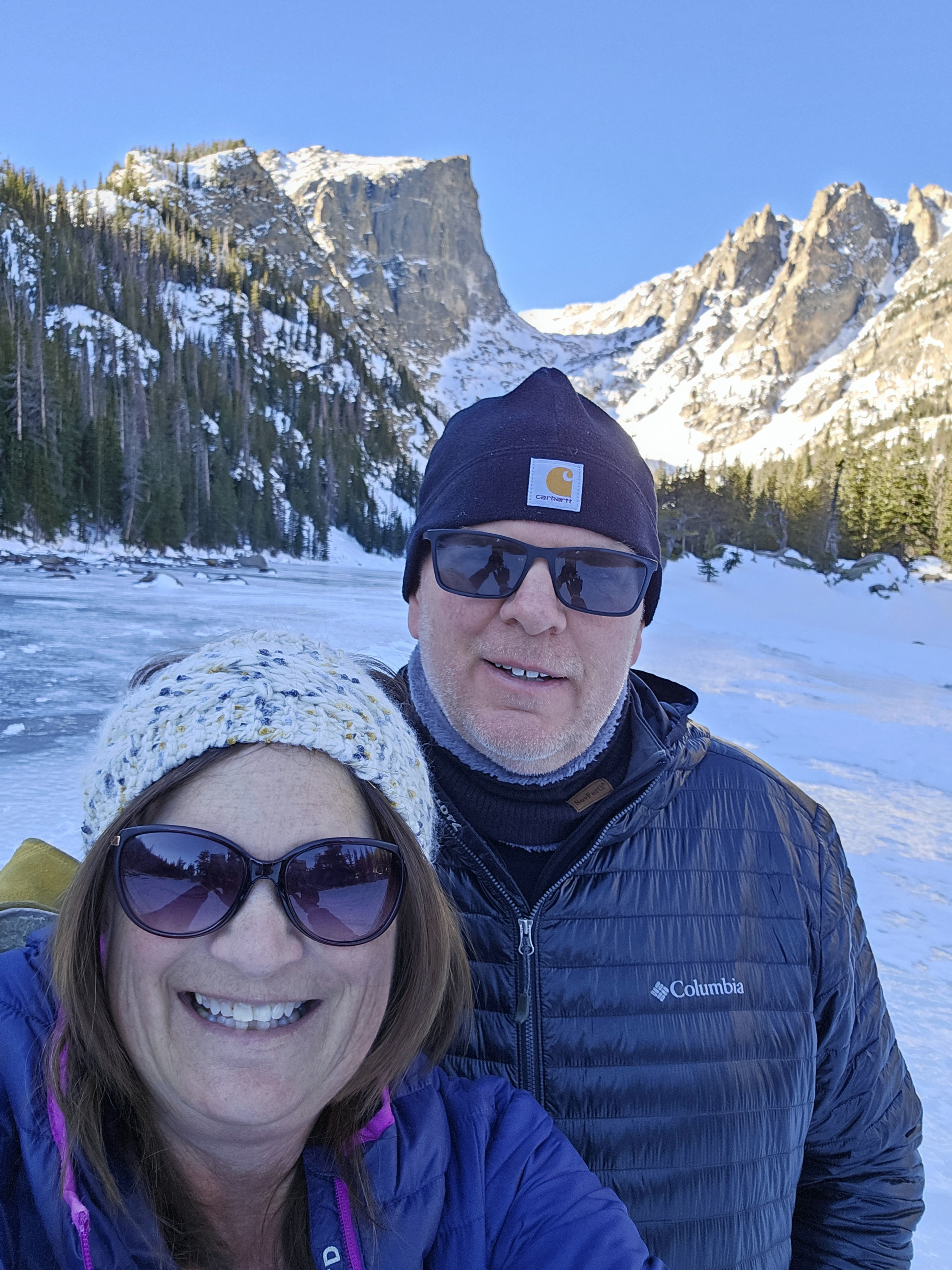 man and woman at frozen lake