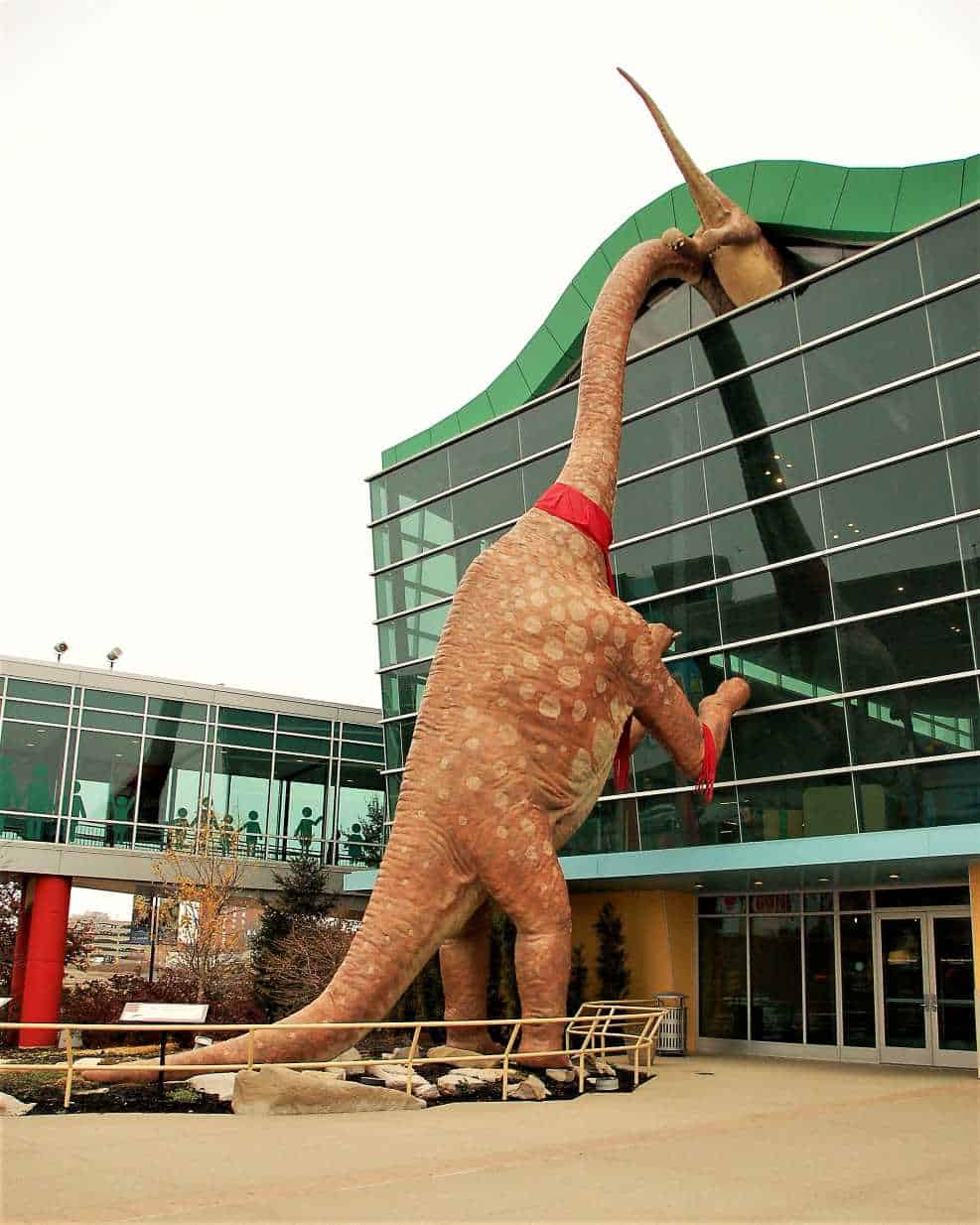 dinosaur outside building