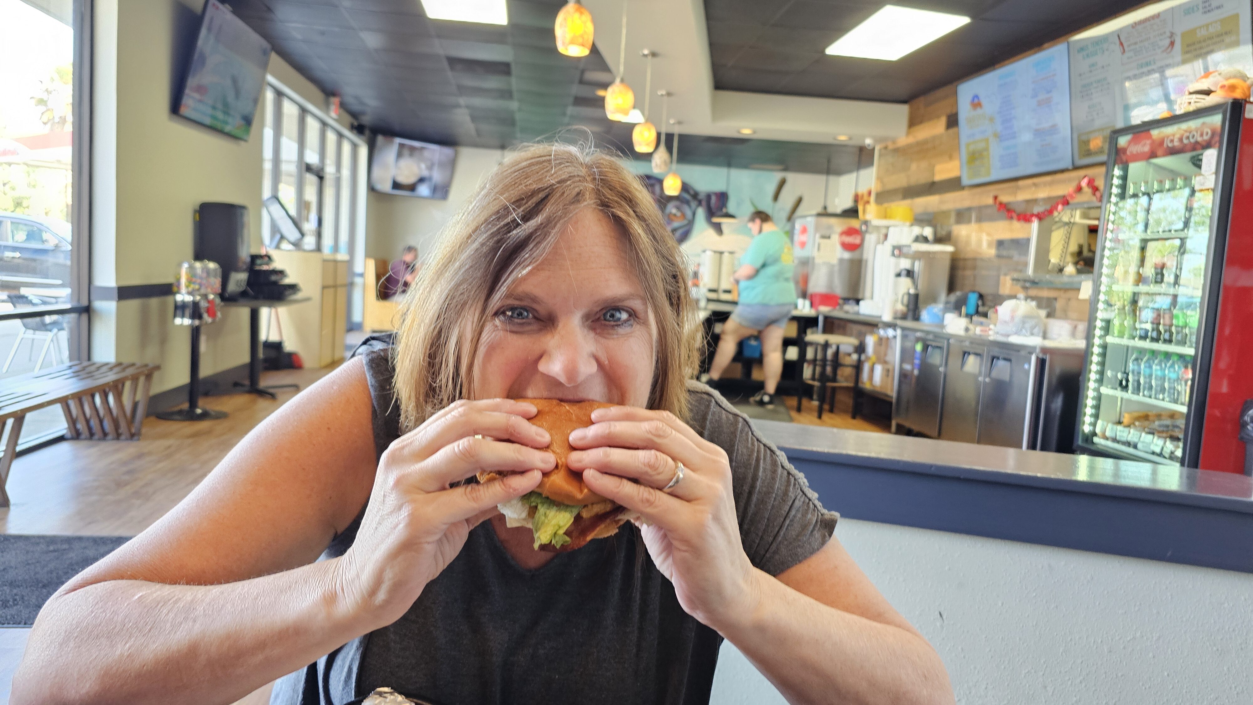 woman eating chicken sandwich