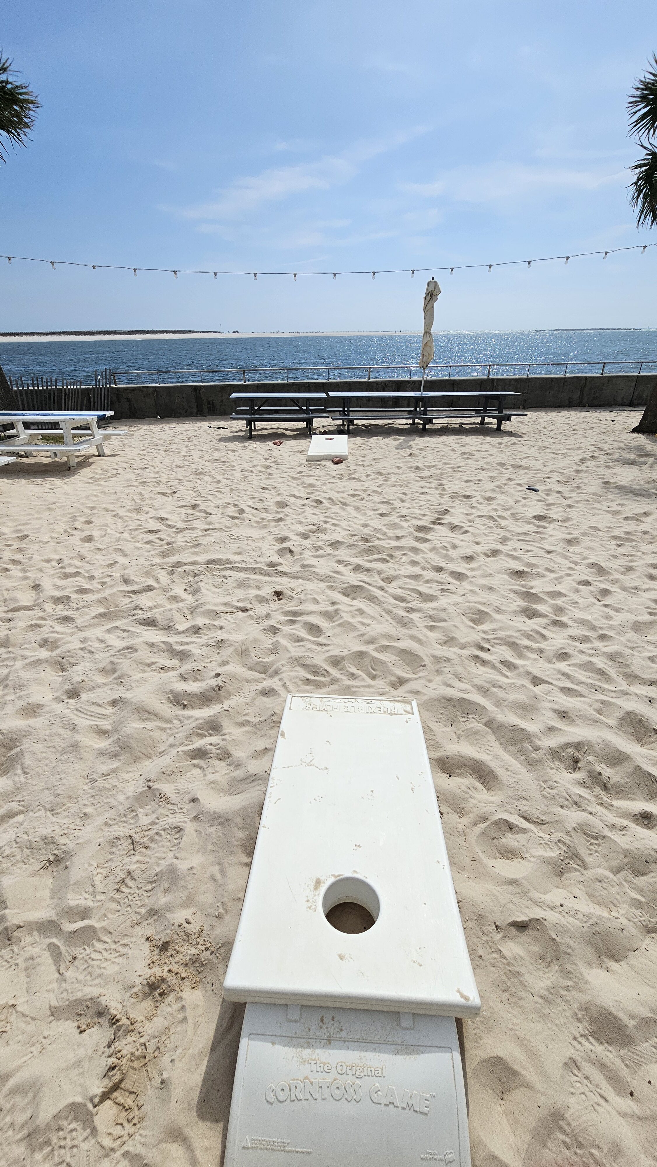 bean bag toss on beach