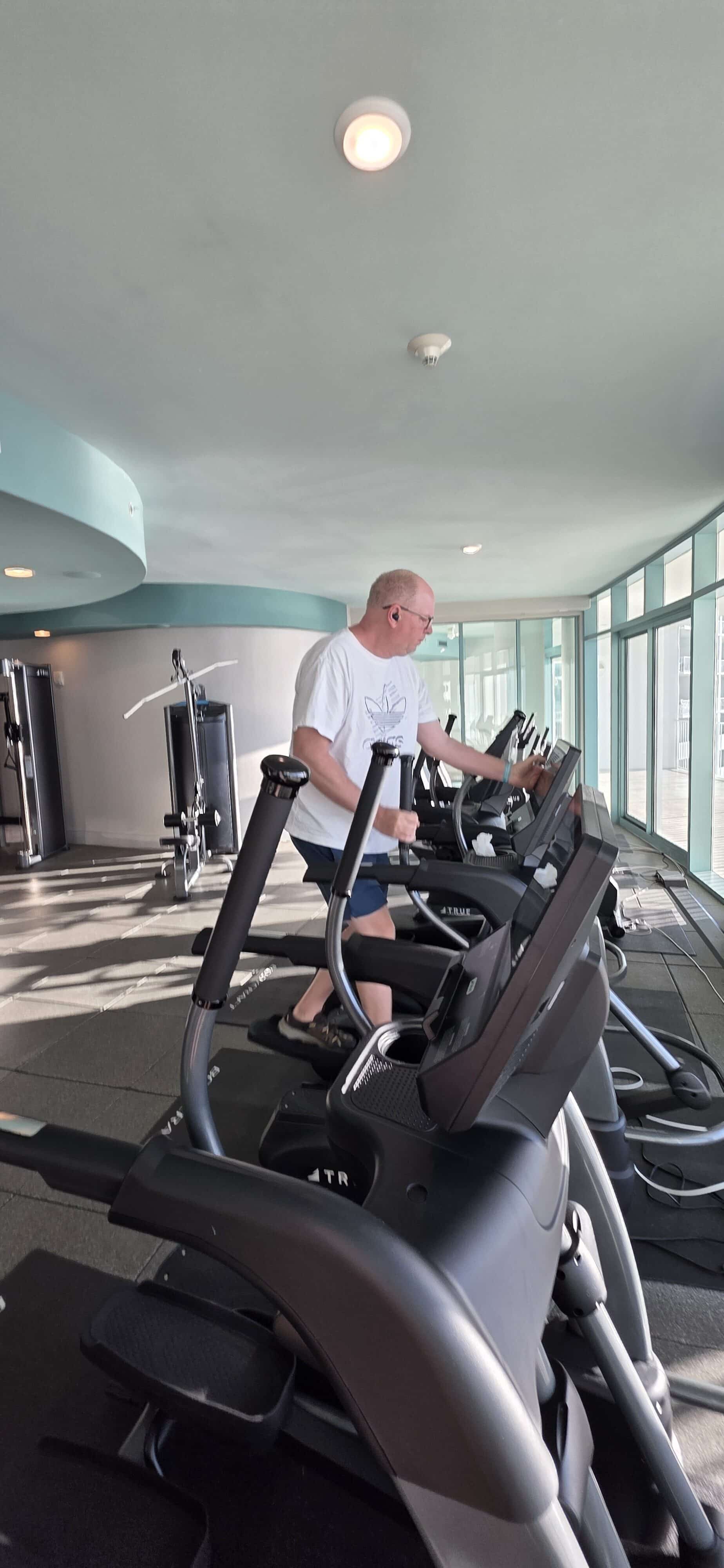man on elliptical machine