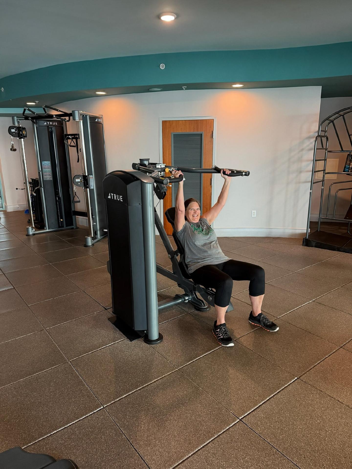 woman lifting weights beach club spa and resort