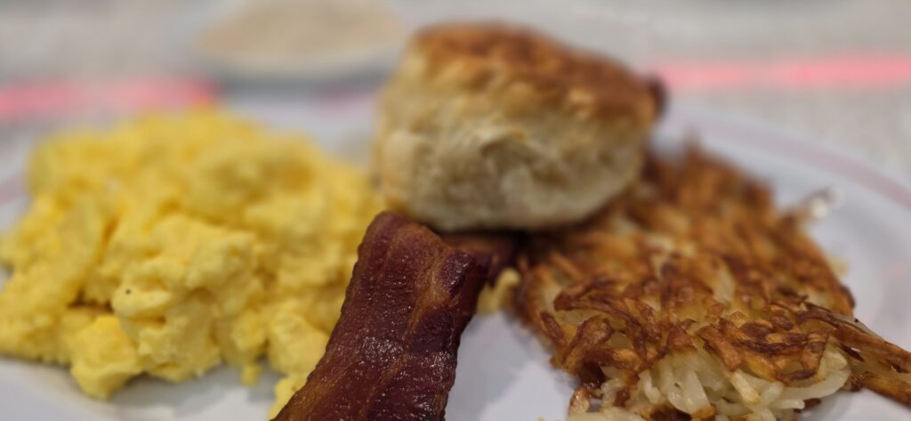Breakfast of eggs, bacon, hashbrowns, and a biscuit at Sunliner Diner in Orange Beach, Alabama.