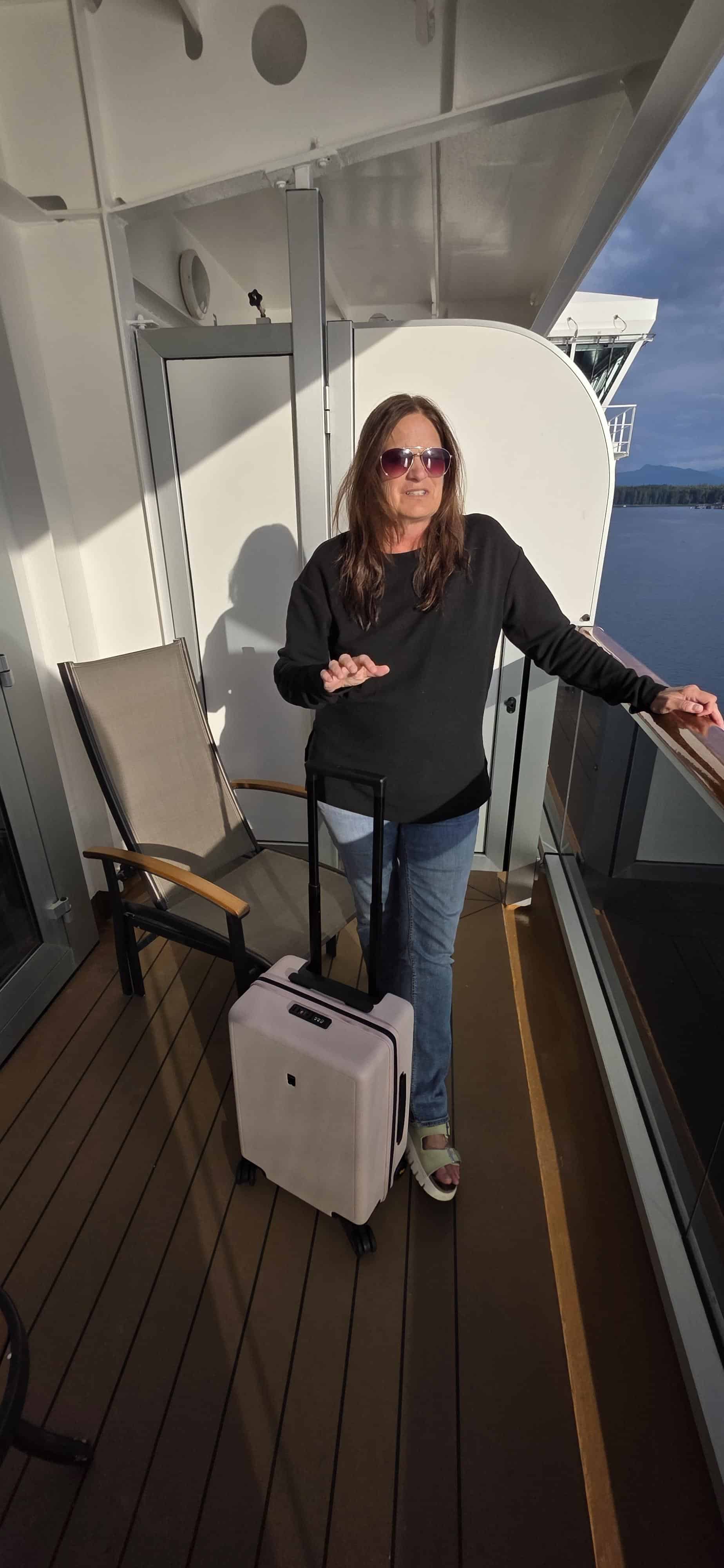 woman with pink suitcase