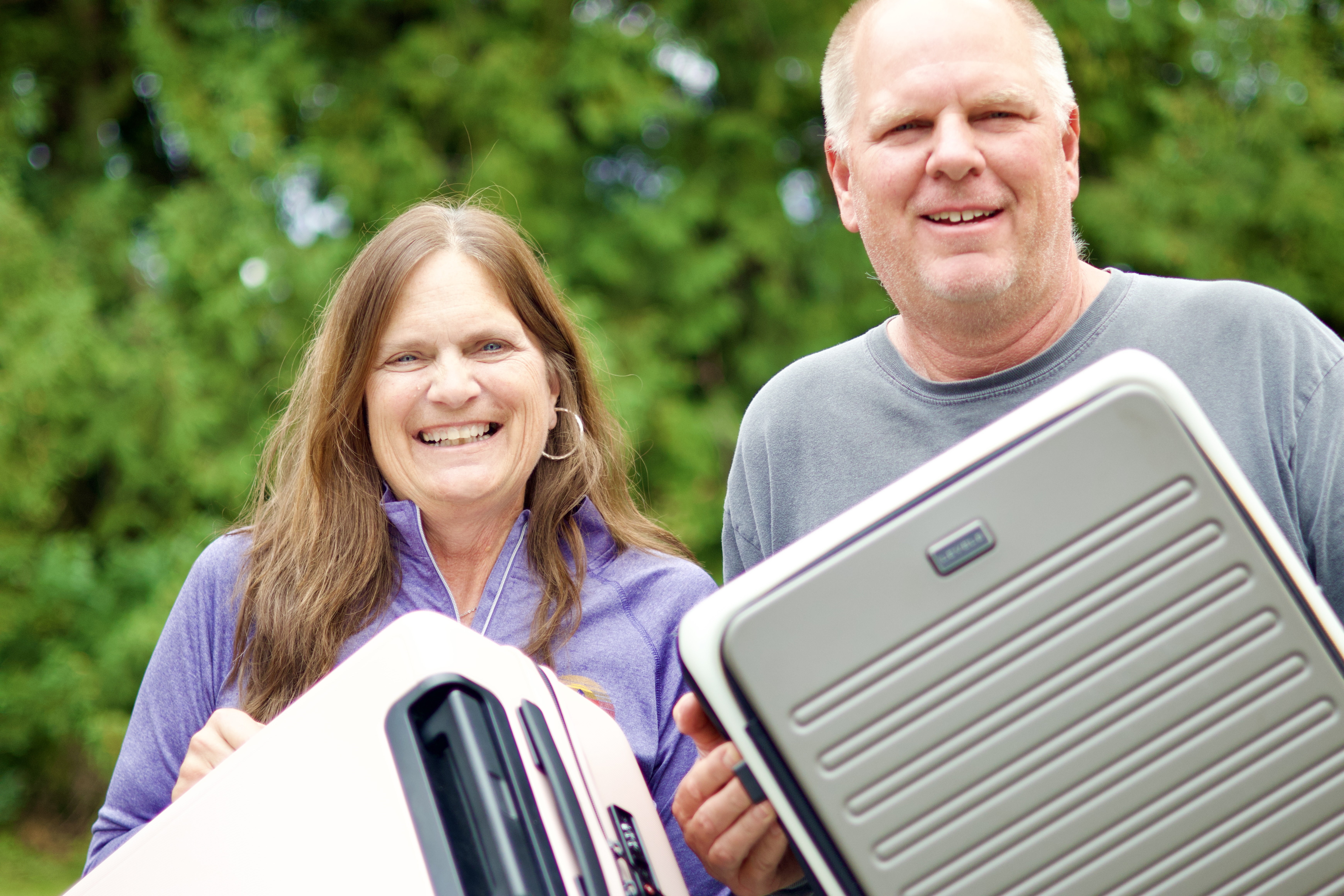 Man and Woman with Level 8 Suitcases